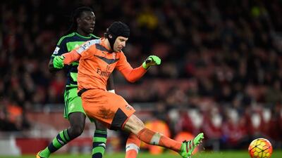 LONDON, ENGLAND - MARCH 02: Petr Cech of Arsenal clears the ball from Bafetimbi Gomis of Swansea City during the Barclays Premier League match between Arsenal and Swansea City at the Emirates Stadium on March 2, 2016 in London, England. (Photo by Mike Hewitt/Getty Images)