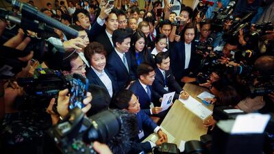 Thai Raksa Chart Party leader Preechapol Pongpanich shows a document nominating Princess Ubolratana Mahidol as candidate for prime minister during election registration at the Election Commission in Bangkok, Thailand. EPA