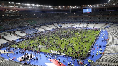 Spectators invade the pitch of the Stade de France stadium after the international friendly soccer France against Germany, Friday, Nov. 13, 2015 in Saint Denis, outside Paris. AP Photo