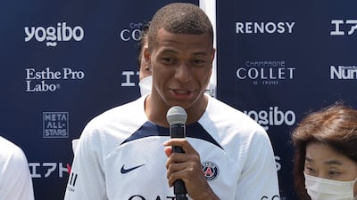 Paris Saint-Germain player Kylian Mbappe speaks during a soccer clinic at a stadium in Tokyo. AFP