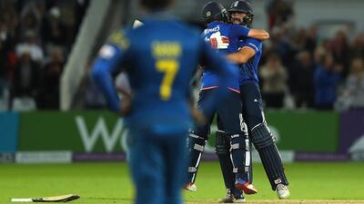 Lian Plunkett, right, hit a last-bal six against Sri Lanka to help Chris Woakes secure a tie for England. Warren Little / Getty Images