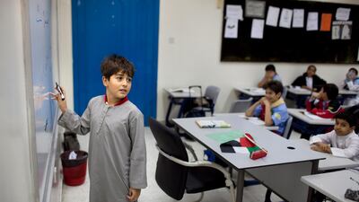 Al Ruwais Primary Boys School students work on reading problems during an Arabic language class in 2011. The Dubai Knowledge Summit was told on Tuesday of a joint plan to eradicate illiteracy in the Middle East. Silvia Razgova / The National.