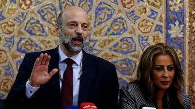 Jordan's Prime Minister Omar Al Razzaz and Minister of State for Media Affairs Jumana Ghunaimat arrive for their news conference in Amman. Reuters