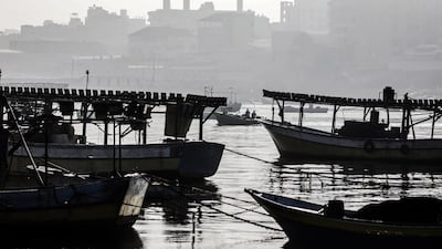 Boats of Palestinian fishermen sail through Gaza port in Gaza City. EPA