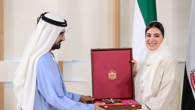 Sheikh Mohammed bin Rashid, Vice President and Ruler of Dubai, presents a Zayed the Second Medal to Hana Al Hashimi, chief Cop28 negotiator for the UAE. Ministry of Presidential Affairs