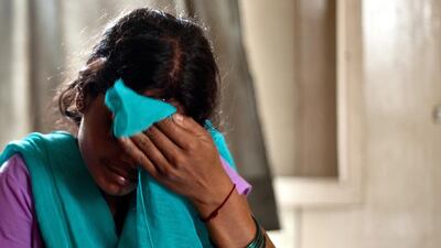 This alleged victim of human-trafficking in India weeps after being rescued from a village in Karnal about 100 kms from New Delhi. Mana Vatsyayana / AFP