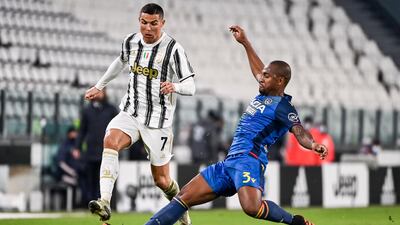 Juve's Cristiano Ronaldo is challenged by Samir Santos of Udinese. AP