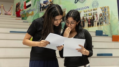 Nishna and Jeni compare results at Arcadia British School
