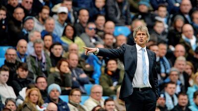 Manchester City manager Manuel Pellegrini reacts during their Premier League win over West Ham United on Sunday at the Etihad Stadium. Peter Powell / EPA / April 19, 2015