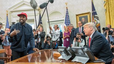 Kanye West talks with President Donald Trump in the White House's Oval Office on October 11, 2018. Getty Images