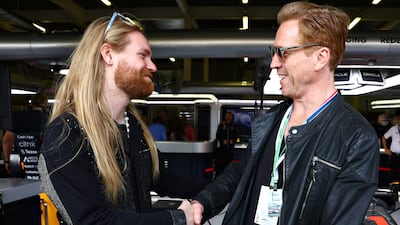 Damien Lewis and Sam Ryder meet outside the Red Bull garage. Getty