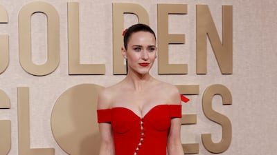 Rachel Brosnahan was one of several celebrities who wore red on the red carpet. AFP