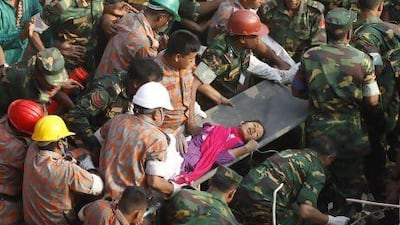 Rescuers carry Reshma, a garment-factory worker, from the rubble on May 10, 17 days after the eight-storey building in which she worked collapsed. AFP