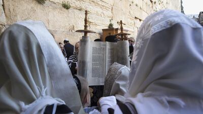 Jewish worshippers reads from the Torah scroll during a special priestly blessing for Passover at the Western Wall, Judaism's holiest prayer site, in Jerusalem's Old City on April 6, 2015. Ronen Zvulun / Reuters