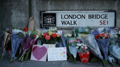 Tributes on London Bridge after Usman Khan stabbed two people to death and injured three others before being shot dead by police. AP