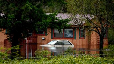 A car stands partially submerged in floodwaters during Tropical Storm Florence near Beulaville, North Carolina. Bloomberg