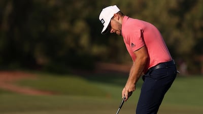 England's Tyrrell Hatton of England putts on the 14th hole. Getty