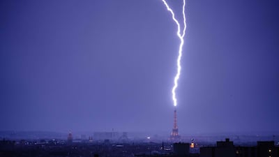 Lightning strikes the Eiffel Tower during a thunderstorm in Paris. AFP