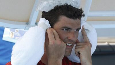 John Isner cooling off during his first round match. The American had to retire with a foot injury.