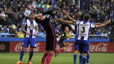 Barcelona’s Gerard Pique, centre, reacts after missing a shot. Paulo Duarte / AP Photo