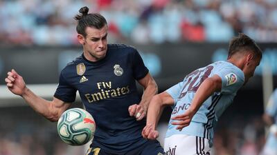 Gareth Bale, left, challenges for the ball with Kevin Vazquez. AP Photo