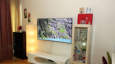 Dr Hassan and her family enjoy watching movies together on the TV in the living room