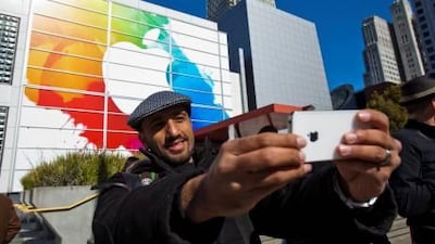Mohammed Jawad of Dubai takes a photo of himself and the Yerba Buena Centre of California, where Apple unveiled the latest iPad.