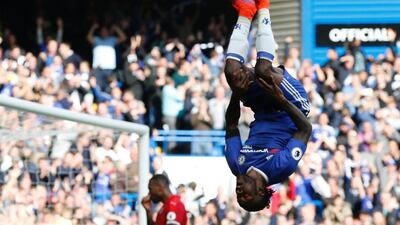 Chelsea’s Nigerian midfielder Victor Moses, right, celebrates after scoring their third goal against holders Leicester City at Stamford Bridge on October 15, 2016. Chelsea won the game 3-0. Adrian Dennis / AFP