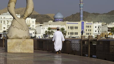 A man walks along the Mutrah Corniche seafront in the old city of Muscat, Oman. Christopher Pike / Bloomberg