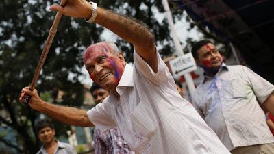 An elderly Bangladeshi Hindu dances in front of a x temple on the last day of Durga Puja festival in Dhaka, Bangladesh. AM Ahad / AP Photo