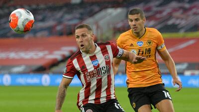 Sheffield United's Billy Sharp, left, vies with Wolverhampton Wanderers' Conor Coady. AFP