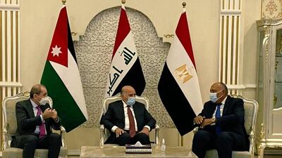 Iraqi Foreign Minister Fuad Hussein, centre, and his Egyptian and Jordanian counterparts, Sameh Shoukry and Ayman Safadi. MFA Egypt