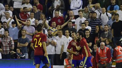 Santi Cazorla celebrates with Juan Mata after scoring the second goal. Pierre-Philippe Marcou / AFP