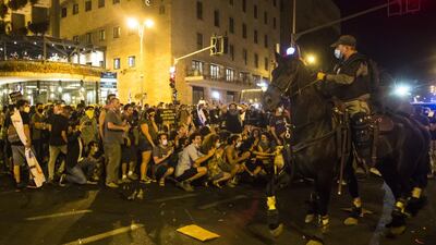 Police officers patrol the streets on horses during a demonstration in Jerusalem, Israel. Demonstrations continue against Prime Minister Benjamin Netanyahu and the government's handling of the coronavirus (COVID-19) crisis. Getty Images