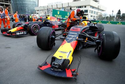The cars of Red Bull Racing's Daniel Ricciardo and Max Verstappen after crashing out during the race in Azerbaijan. David Mzinarishvili / Reuters