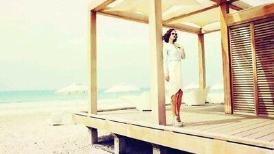 Shirt, Ports 1961; skirt, Willow, both at Symphony. Shoes, Versace. Sunglasses, A-morir at S*uce. Tina Chang / The National