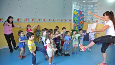 Clare Farrell, right, leads the young participants in one of her MiniFit fitness classes. Courtesy Ollie Farrell