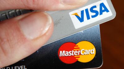Visa and MasterCard want to boost credit card usage in their bid to force consumers to adopt a cashless world.Kevin Lamarque /Reuters
