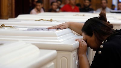 A relative of a slain Christian grieves during the funeral service at Church of Great Martyr Prince Tadros. AP Photo