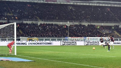 AC Milan’s Mario Balotelli converts a penalty to score the lone goal in his team’s 1-0 Coppa Italia semi-final first leg victory. Andrea Di Marco / EPA
