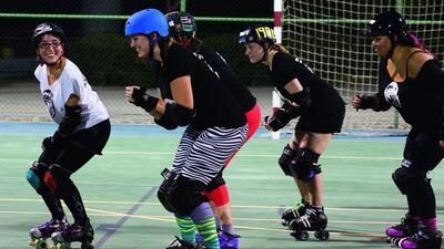 Players from the Dubai Roller Derby team practise their moves at Meydan Tennis Academy. The sport is often described as rugby on roller skates. Photos by Duncan Chard for the National