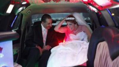 A Jordanian groom takes his bride from her home to their wedding party with a limozine rented for five hours at U.S.$500.00 in Amman.