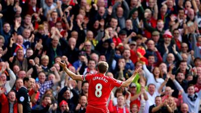 Steven Gerrard of Liverpool celebrates in front of the home fans after scoring his side's goal in a 1-1 draw with Everton in the Premier League on Saturday. Alex Livesey / Getty Images / September 27, 2014