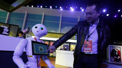 An exhibitor demonstrates a face-detection flight-boarding system at an exhibition venue during Alibaba Group's 11.11 Singles' Day global shopping festival in Shenzhen, China, on November 11, 2016. Bobby Yip / Reuters