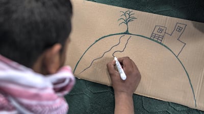 Climate change activists prepare for a demonstration in Kabul. Stefanie Glinski for The National
