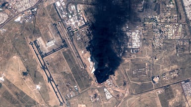 A satellite image of smoke billowing near Kuwait International Airport as Iran presses on with its attacks. AFP