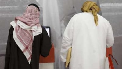 Emiratis attending the Abu Dhabi recruitment show earlier this year: citizens should accept entry-level jobs and accept market-related wages, says an official.