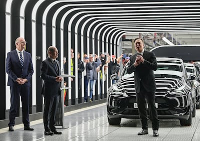 (L-R) Dietmar Woidke, Minister President of the State of Brandenburg, German Chancellor Olaf Scholz and Elon Musk attend the opening of the Tesla factory in Gruenheide, Germany. AP