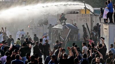 Security forces use water cannon to prevent supporters of the Co-ordination Framework from entering the Green Zone. AFP