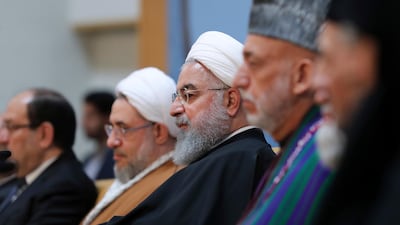 President Hassan Rouhani, centre, attends an annual Islamic Unity Conference in Tehran, Iran, Saturday, Nov. 24, 2018. AP